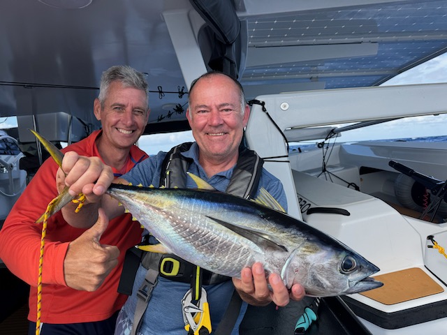 Derek and Chris with a tuna caught under way